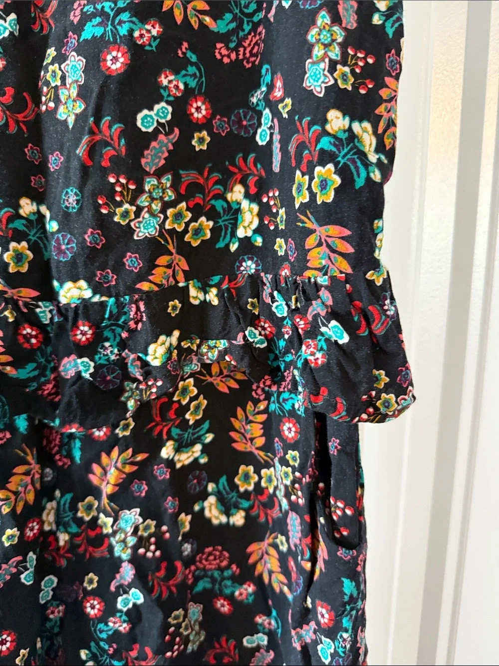 Gently worn Black Floral Ruffled Waist Sleeveless Romper